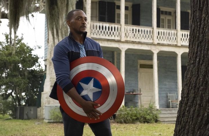 Anthony Mackie holds Captain America's shield.