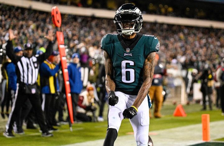 DeVonta Smith of the Philadelphia Eagles flexes in the end zone.