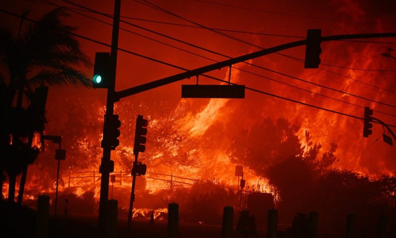 Flames overtake the intersection of Temescal Canyon and Pacific Coast Highway Fire at the Palisades Fire.