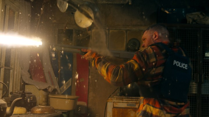 Tom Hardy firing a rifle in Havoc.