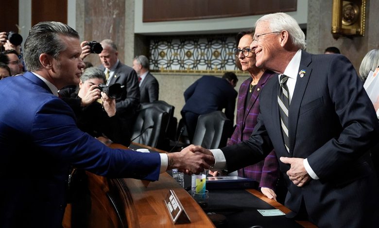 Pete Hegseth shaking hands with Chairman Roger Wicker