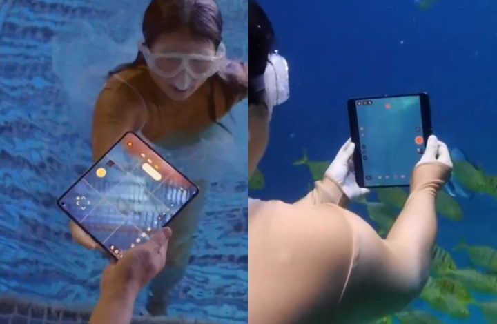 Person using the Oppo Find N5 underwater.