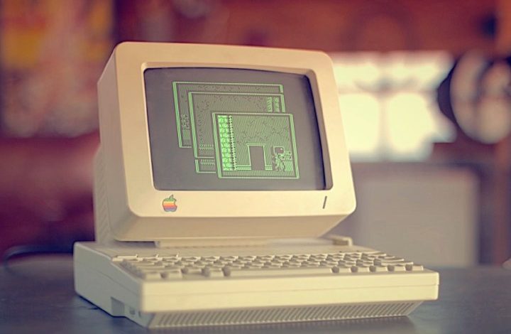 An Apple II computer on a desk.