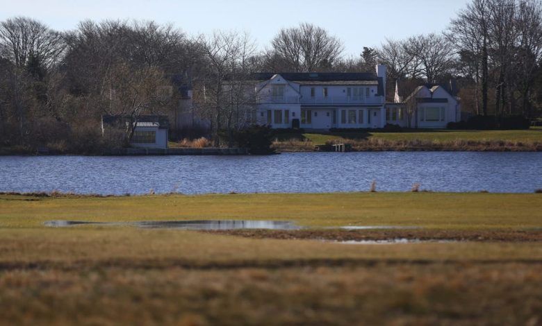 An estate is seen near a golf club in East Hampton