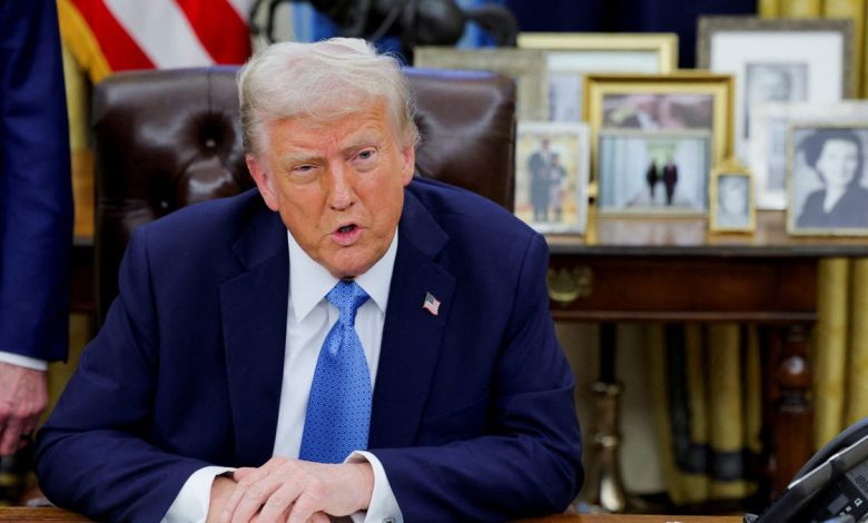 Trump speaks to reporters at the White House while signing executive orders