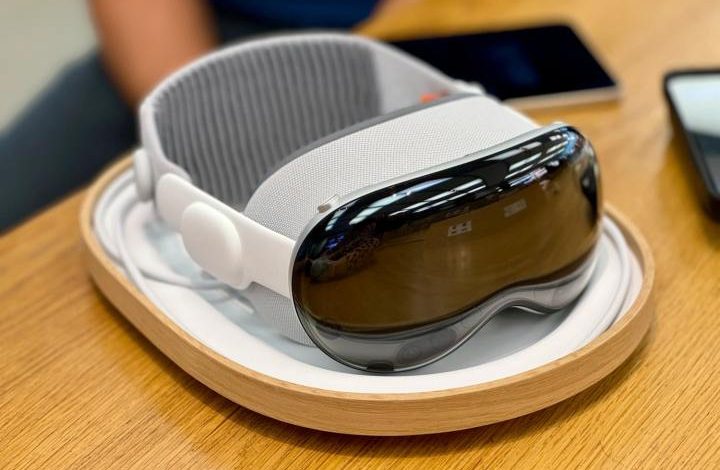 An Apple Vision Pro demo unit on a desk in an Apple Store.