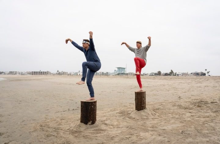 Daniel and Johnny stand on stumps and kick in Cobra Kai season 6.