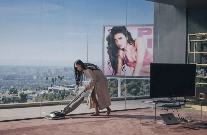 Demi Moore vacuums in "The Substance."