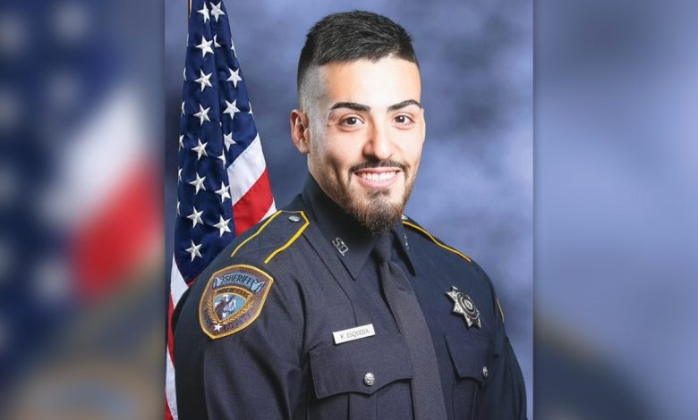 Harris County Sheriff's Deputy Fernando Esqueda in uniform in front of a US flag in this portrait provided by the sheriff.