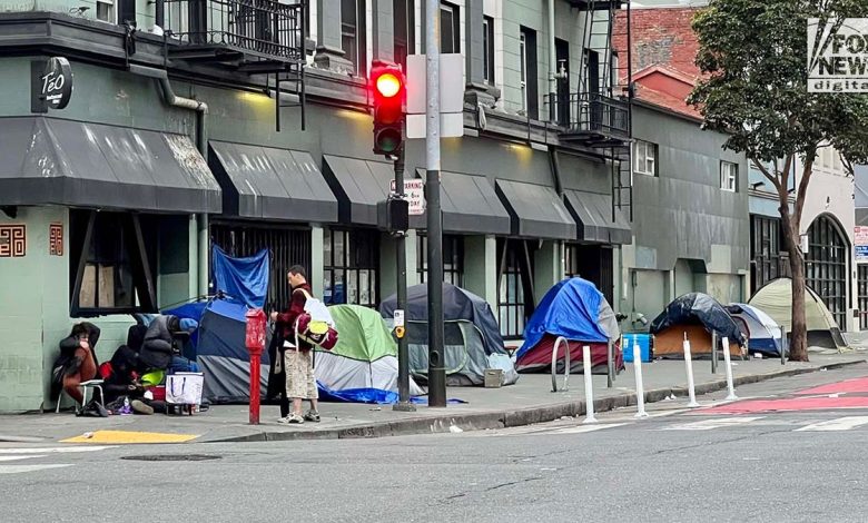 People inhabit encampments on the streets of San Francisco's Tenderloin District.