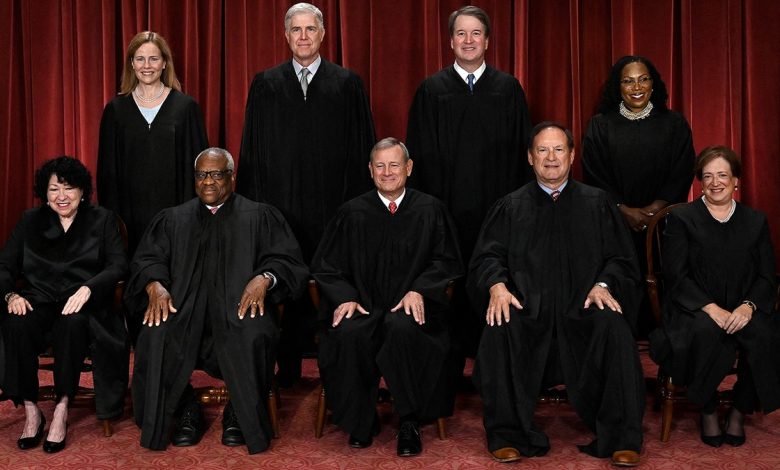 Supreme Court Justices sitting for a portrait.