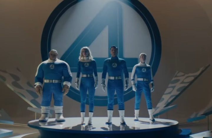 The Fantastic 4 stand on a platform.