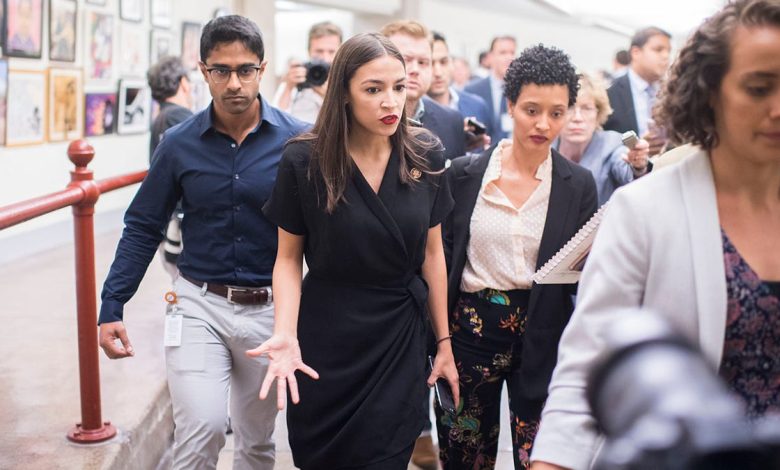 AOC, center, with Saikat Chakrabarti behind her on left