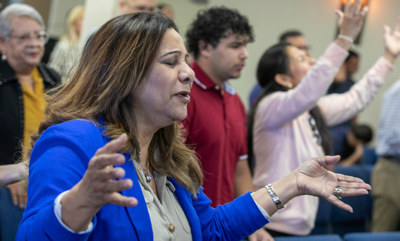 Fatima Guzman prays during a church service