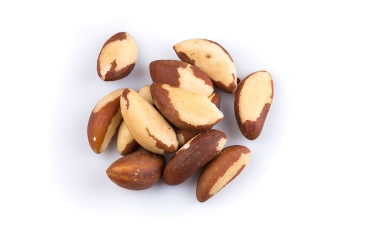 Cluster of oblong nuts with brown peels