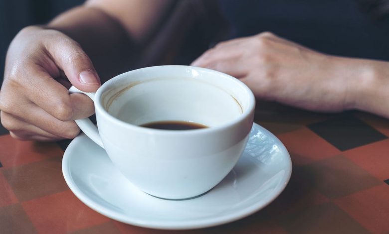 hand holding and drinking hot coffee