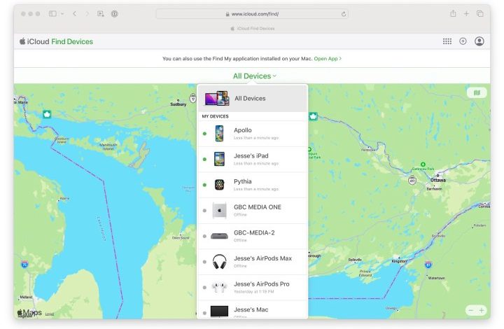 Apple's Find My Devices website showing a list of devices against a background map.