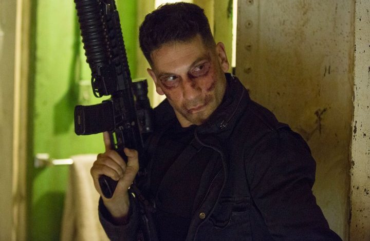 Jon Bernthal holds a gun in The Punisher.