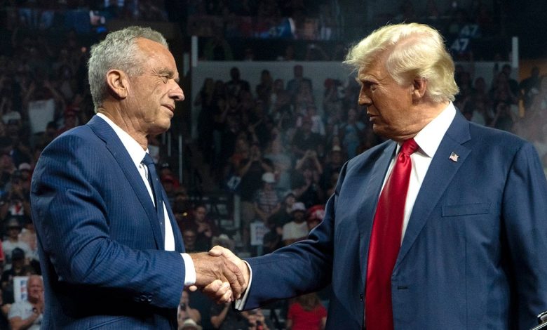 Robert F. Kennedy Jr. shakes hands with Donald Trump