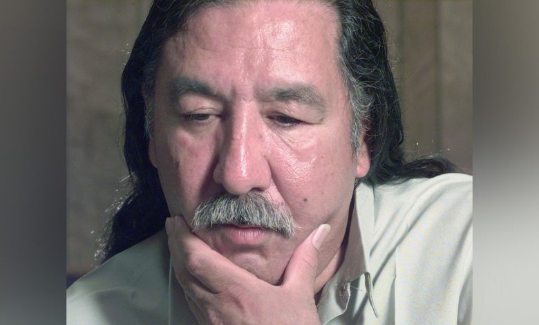 Leonard Peltier looks on during an interview