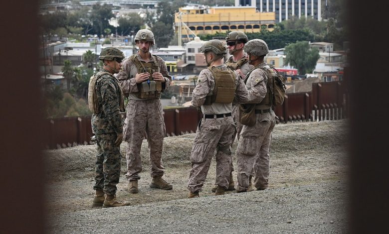 United States Marine Corps troops patrol the US-Mexico border