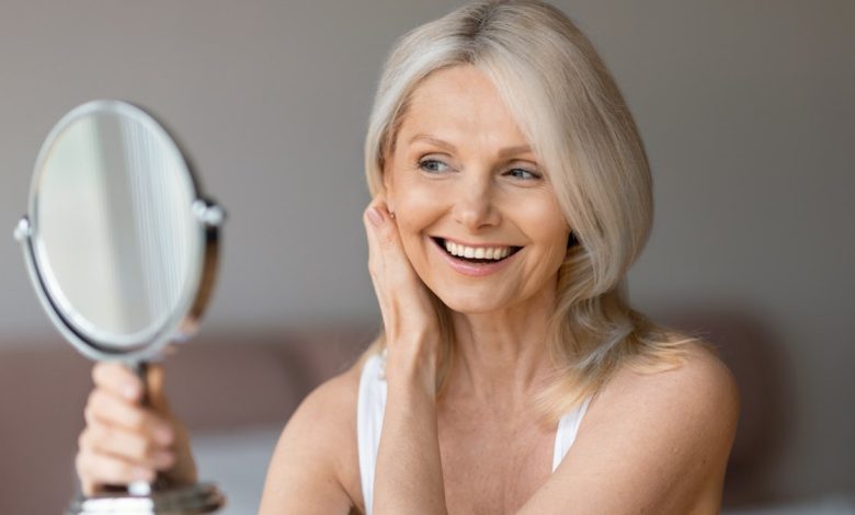 Older woman hand mirror