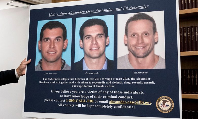 A display showing images of Alon, Oren, and Tal Alexander prior to a news conference in New York