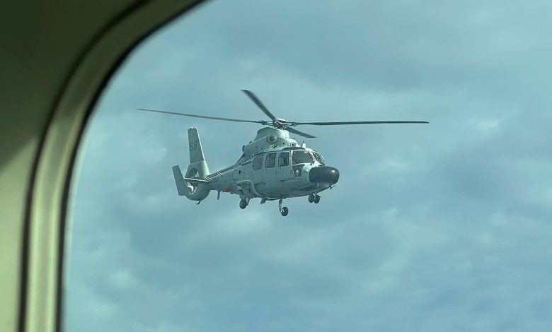 Chinese navy helicopter flies within 10 feet of Philippine patrol plane over disputed shoal