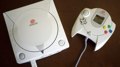 A Dreamcast sits on a table.