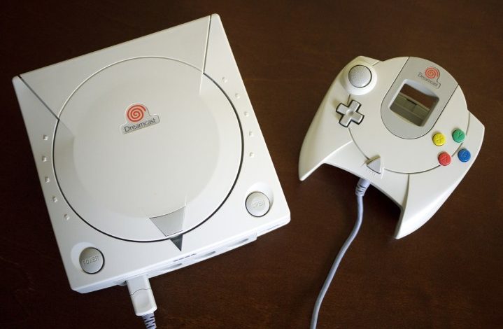 A Dreamcast sits on a table.