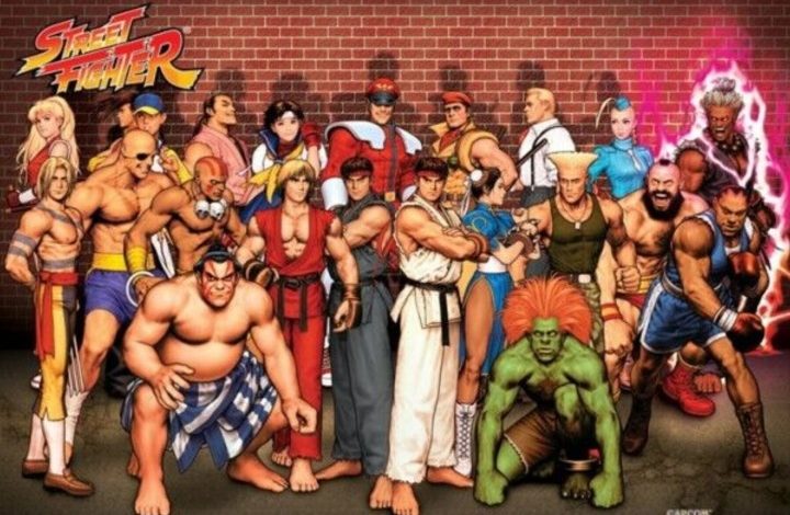 Street Fighter characters stand together in front of a brick wall.