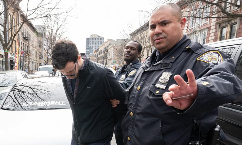 Michael Lewis, 42, was accused of drawing a hate symbol on a New York City Cybertruck.