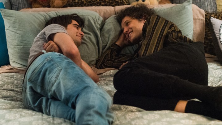 Alex and Eliot in bed together laugghing in Alex Strangelove.