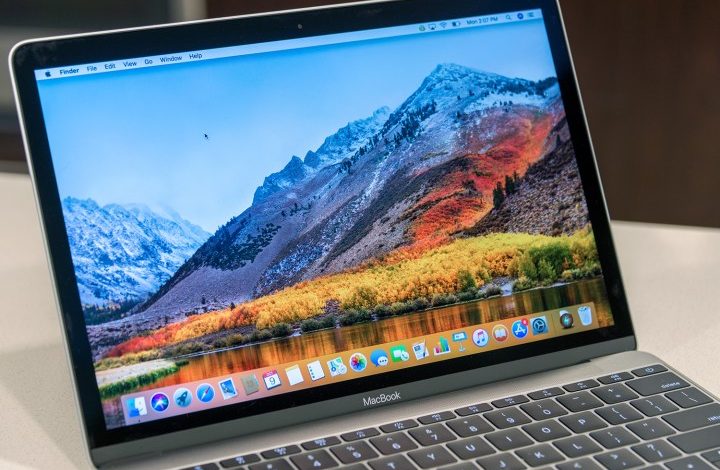 An Apple 12-inch MacBook on a desk.