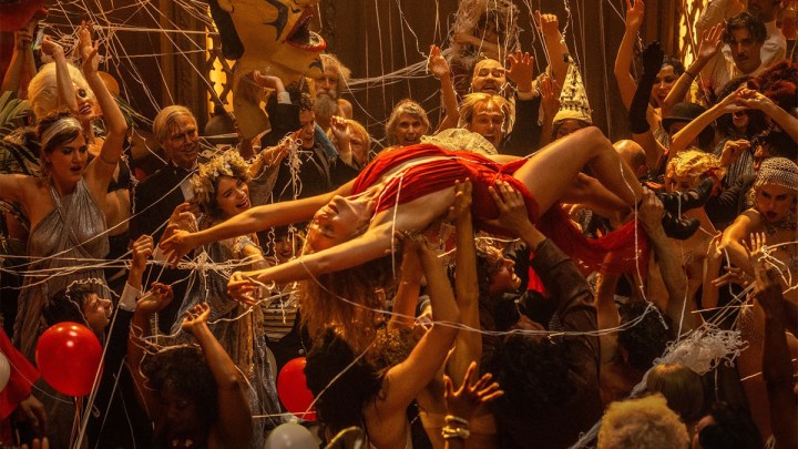 Margot Robbie goes crowd surfing in Babylon.