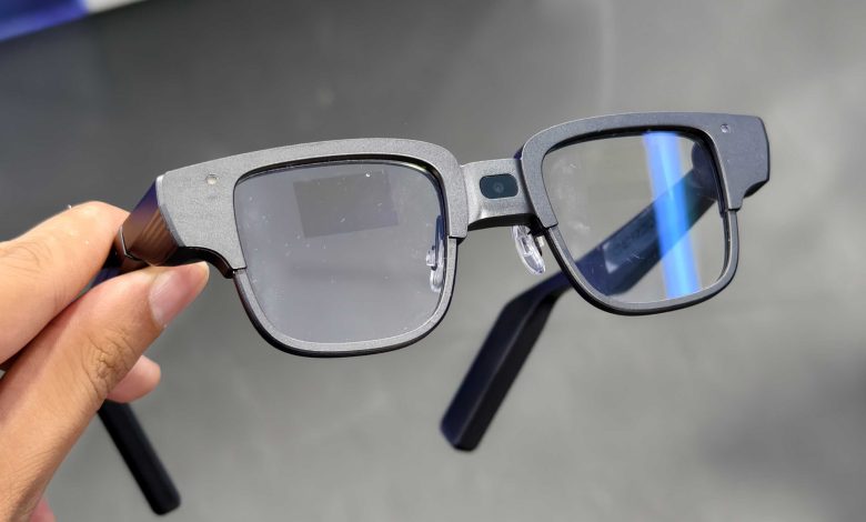 A person holding the Tecno AI Glasses Pro.