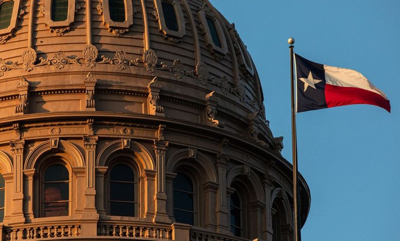 Texas Capitol building dome with the Texas flag waving in front.