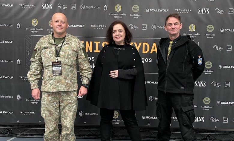 Coinvest Capital managing partner Viktorija Trimbel with Lieutenant Colonel Linas Idzelis (in uniform) and Lieutenant Colonel (retired) Valerijus Šerelis at the 'Fire Shield' hackathon