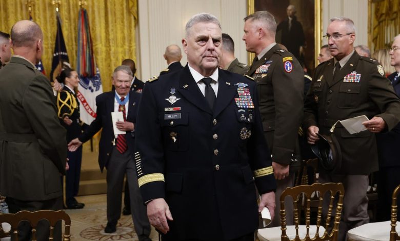 Chairman of the Joint Chiefs of Staff Mark Milley (C) departs the Medal of Honor ceremony for retired U.S. Army Captain Larry Taylor in the East Room of the White House on September 05, 2023 i