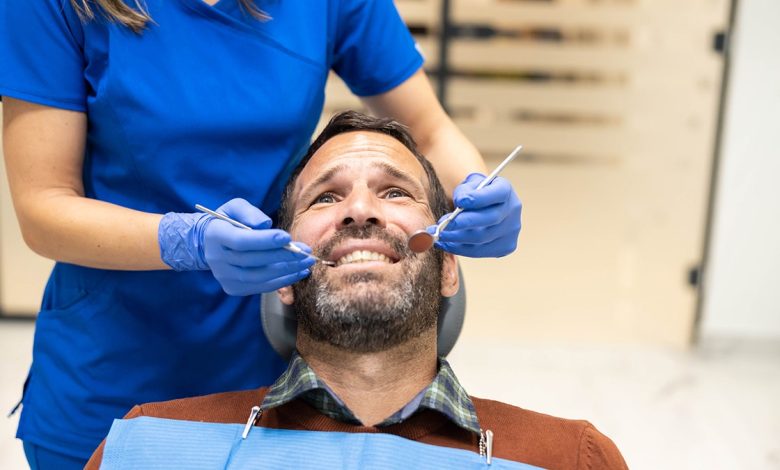 Man looks stressed at dentist