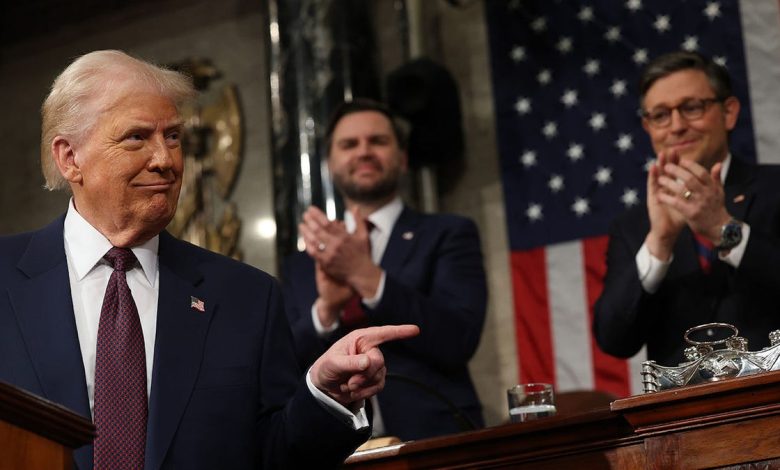 Trump points during congressional address with Vance and Johnson behind him