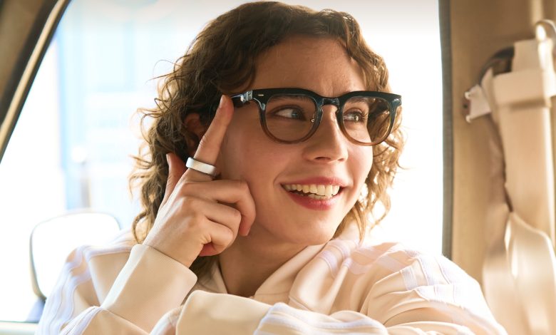 A model wearing the Halliday AI Glasses and smart ring.