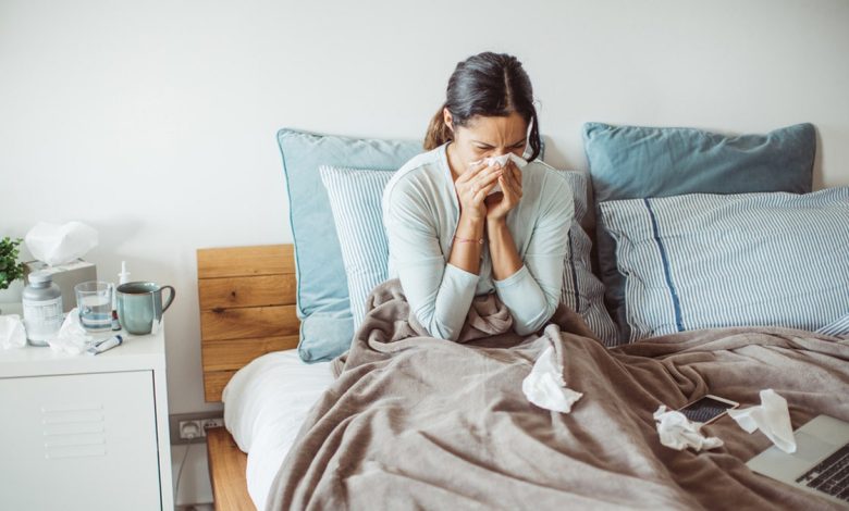 woman blowing nose