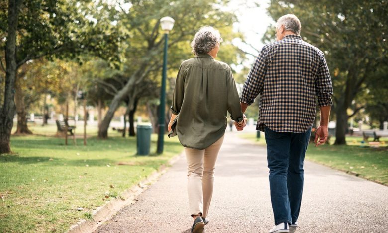 Rearview shot of a senior couple going for a walk in the park