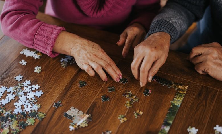 Older people doing puzzle