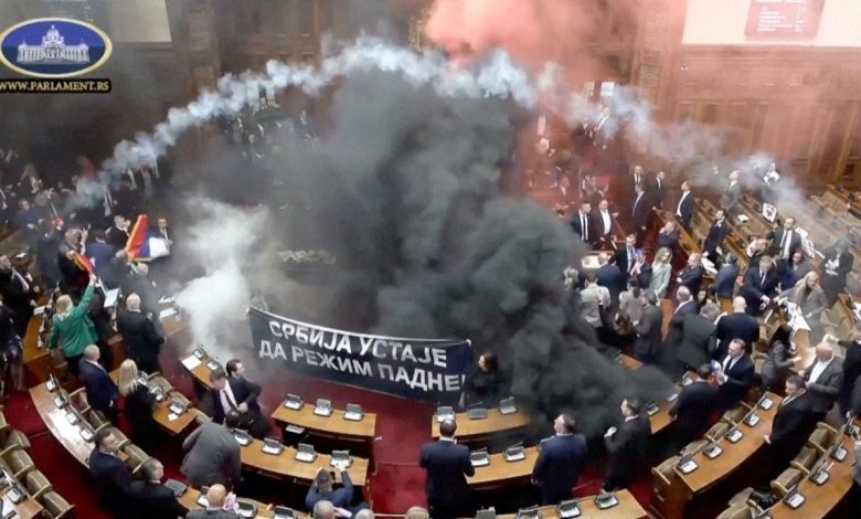 Serbian opposition lawmakers throw smoke grenades, tear gas in parliament