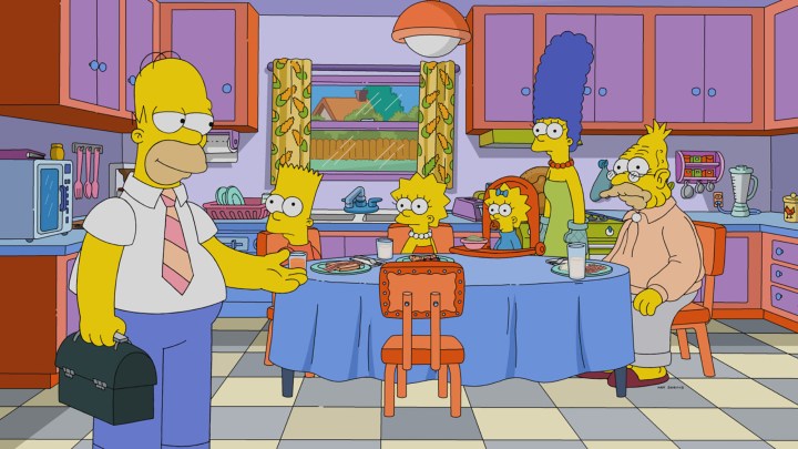 The Simpsons family sitting around the dinner table.