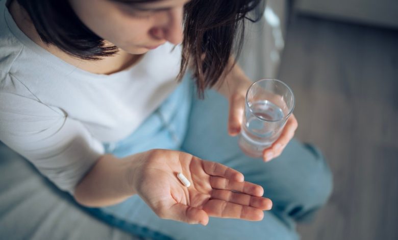 Woman taking pills