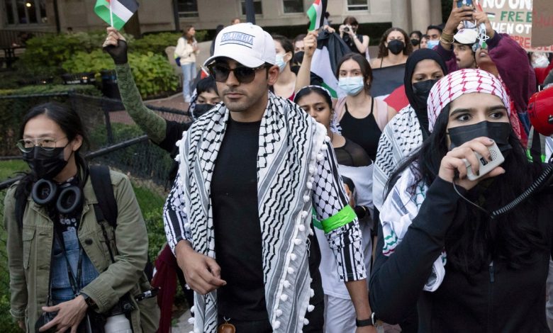 Mohsen Mahdawi, center, looks on during an anti-Israel protest at Columbia University on Oct. 12, 2023, in New York.
