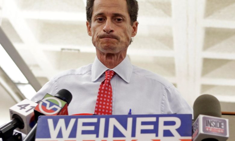 New York City Mayoral candidate Anthony Weiner grimaces during a news conference at the Gay Men's Health Crisis headquarters, Tuesday, July 23, 2013, in New York. The former congressman says he's not dropping out of the New York City mayoral race in light of newly revealed explicit online correspondence with a young woman. (AP Photo/Kathy Willens)